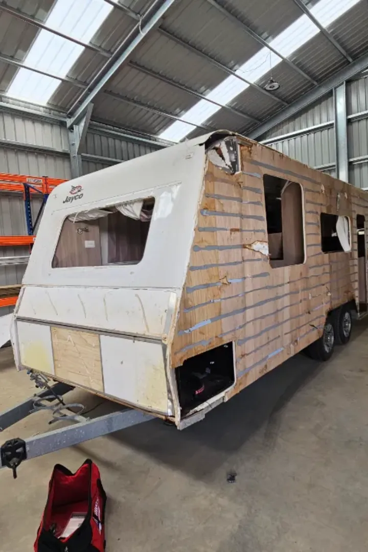 A mobile caravan repair specialist working on a caravan in Adelaide.